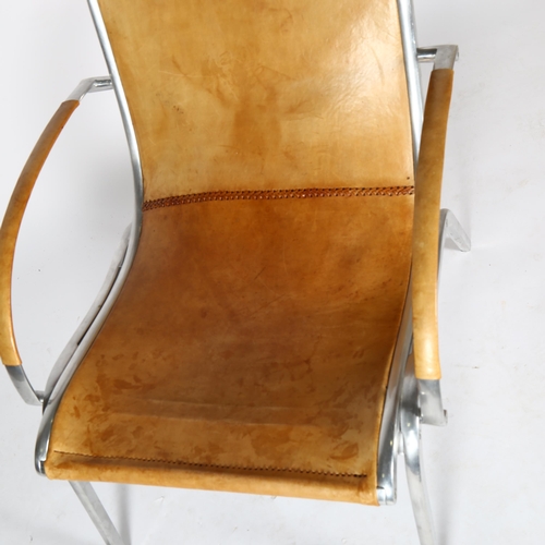 1587 - RUDOLF SZEDLECZKY, attributed, an aluminium and tan leather lounge chair, height 97cm