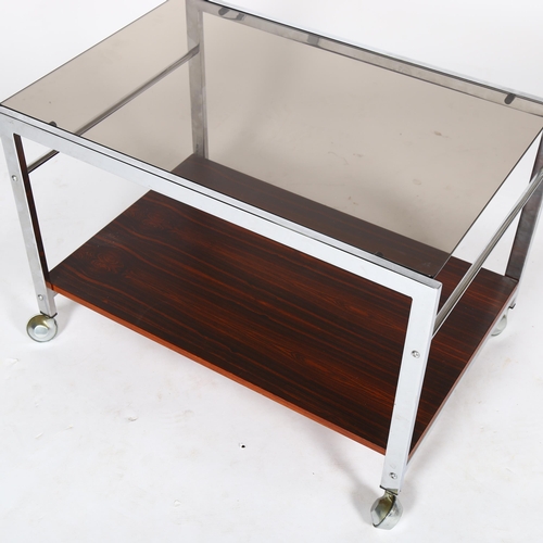 1588 - HOWARD MILLER Ltd, an MDA chrome and faux rosewood, tinted glass side table on casters, top 60 x 42c... 