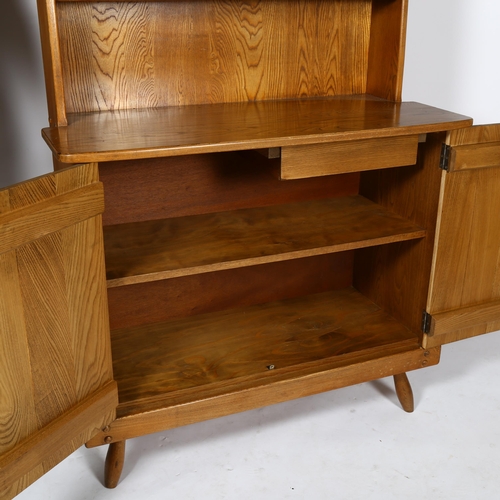 1592 - A mid-century brutalist oak dresser by F Co, the plate rack over 2 door cupboard with interior drawe... 