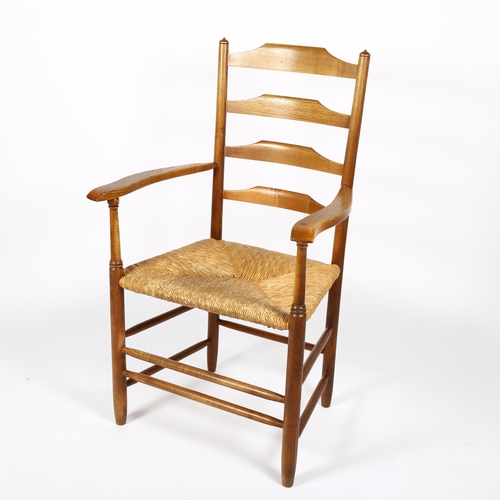 1644 - A mid-century Cotswold School ladderback armchair in the manner of ERNEST GIMSON, stamped J SPARLING... 