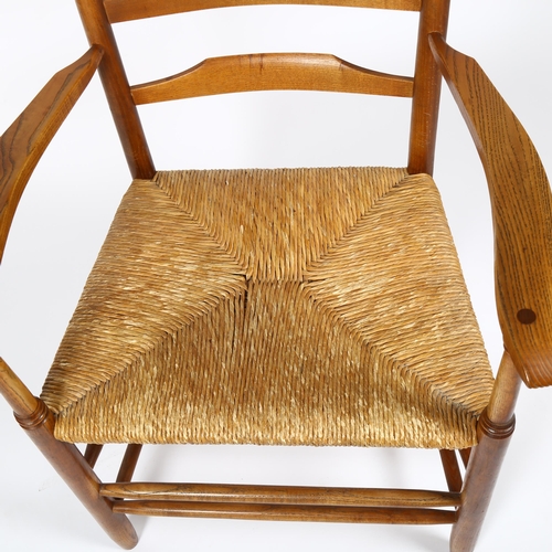 1644 - A mid-century Cotswold School ladderback armchair in the manner of ERNEST GIMSON, stamped J SPARLING... 