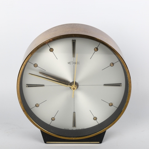 1653 - A mid-century Metamec Quartz clock with copper trim.