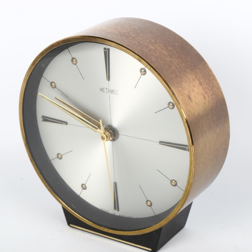 1653 - A mid-century Metamec Quartz clock with copper trim.