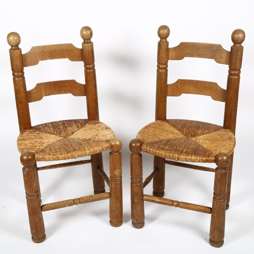 1683 - Attributed to CHARLES DUDOUYT, a pair of mid-century brutalist oak side chairs with flared legs and ... 