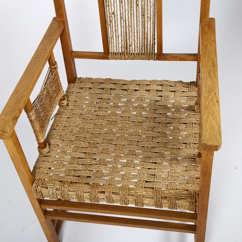 1693 - WILHELM SCHMIDT attributed, an early 20th century oak and cord-work armchair in the manner of PRAG R... 