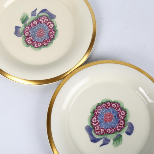 1705 - MARCEL GOUPY for ROUARD, Paris,1930s, a pair of dinner plates with gilt rim and sponged floral decor... 