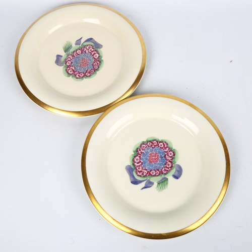 1705 - MARCEL GOUPY for ROUARD, Paris,1930s, a pair of dinner plates with gilt rim and sponged floral decor... 