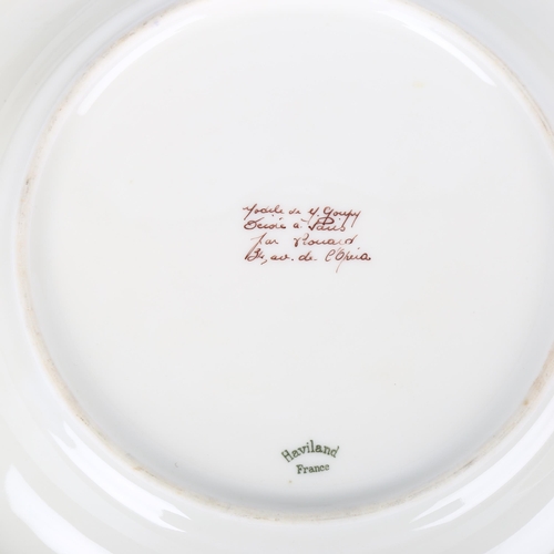 1705 - MARCEL GOUPY for ROUARD, Paris,1930s, a pair of dinner plates with gilt rim and sponged floral decor... 