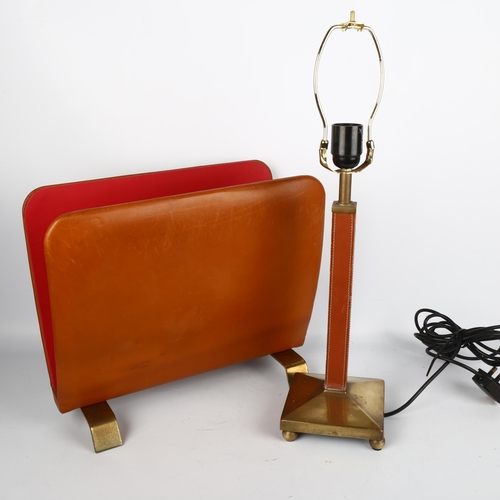 1711 - An ETTINGER leather and brass paper-rack and a similar table lamp.