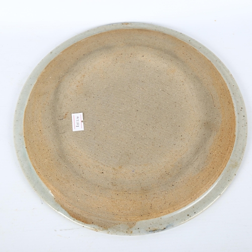 1715 - BRYAN and JULIA NEWMAN, an ALLER studio pottery plate, diameter 26.5cm