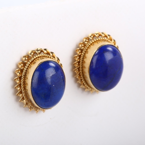 83 - A pair of late 20th century 9ct gold lapis lazuli earrings, set with oval cabochon lapis in twist su... 