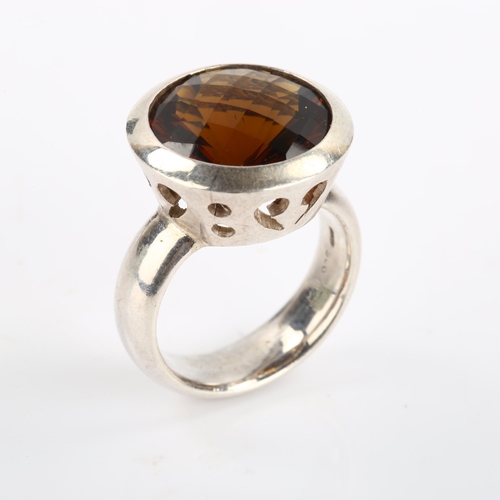 97 - A modern sterling silver smoky quartz dress ring, heavy bezel setting with laser-cut quartz, setting... 