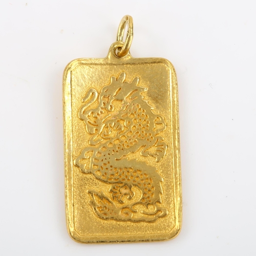 101 - A Chinese 9999 gold dragon ingot pendant, character marks verso, pendant height excluding bale 27.8m... 