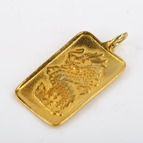 101 - A Chinese 9999 gold dragon ingot pendant, character marks verso, pendant height excluding bale 27.8m... 