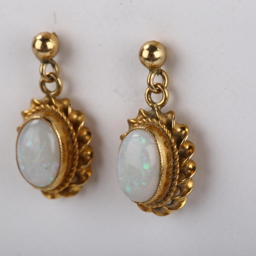 104 - A pair of 9ct gold opal drop earrings, set with oval cabochon white opal within twist surround and s... 