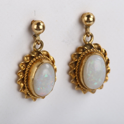 104 - A pair of 9ct gold opal drop earrings, set with oval cabochon white opal within twist surround and s... 