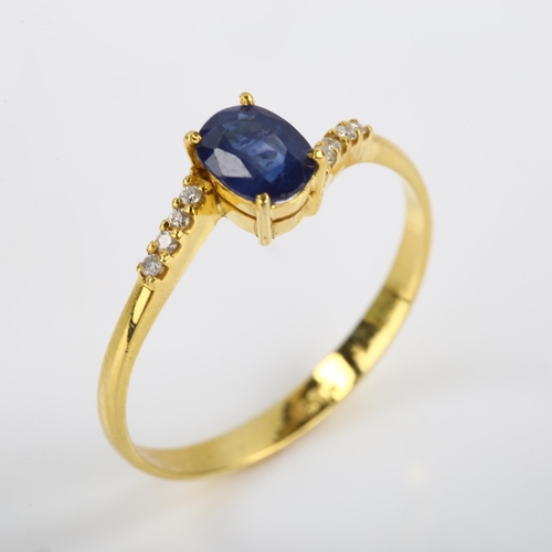 114 - A modern 14ct gold sapphire and diamond crossover ring, set with oval mixed-cut sapphire and modern ... 