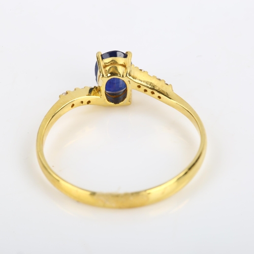 114 - A modern 14ct gold sapphire and diamond crossover ring, set with oval mixed-cut sapphire and modern ... 