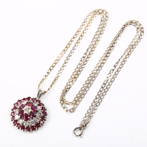 117 - A modern ruby and diamond cluster target pendant necklace, unmarked white gold settings with round-c... 