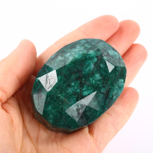 268 - A large unmounted 574ct oval mixed-cut Brazilian emerald, 58.35mm x 42.20mm x 29.55mm, with GLI repo... 