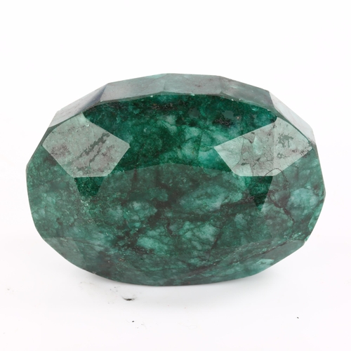 268 - A large unmounted 574ct oval mixed-cut Brazilian emerald, 58.35mm x 42.20mm x 29.55mm, with GLI repo... 