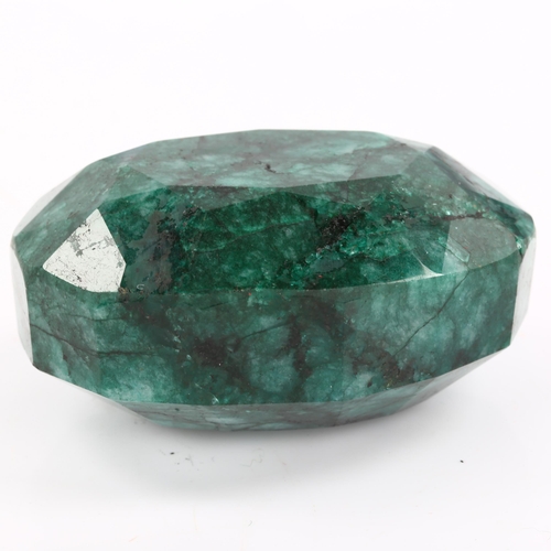 268 - A large unmounted 574ct oval mixed-cut Brazilian emerald, 58.35mm x 42.20mm x 29.55mm, with GLI repo... 