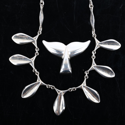 274 - ARNOLD VEGGHAMER - a Danish sterling silver modernist whale flukes pendant, and an unnamed fish frin... 