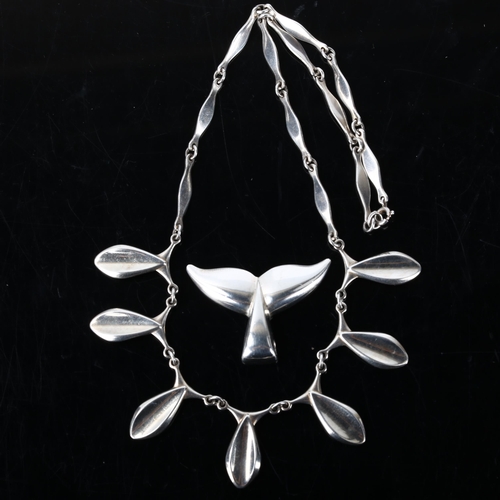 274 - ARNOLD VEGGHAMER - a Danish sterling silver modernist whale flukes pendant, and an unnamed fish frin... 