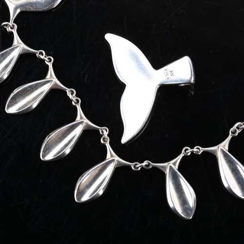 274 - ARNOLD VEGGHAMER - a Danish sterling silver modernist whale flukes pendant, and an unnamed fish frin... 