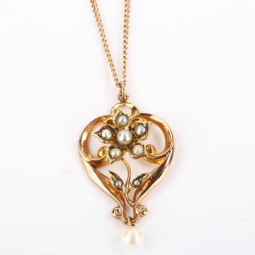 285 - An Edwardian 9ct rose gold pearl floral openwork pendant necklace, on later 9ct fine curb link chain... 