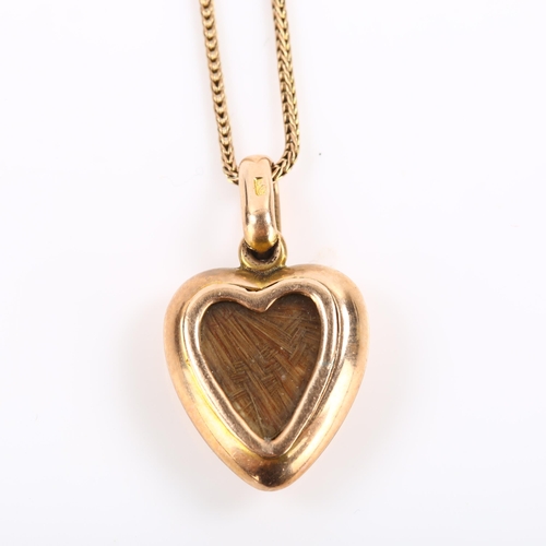 292 - An Antique 9ct rose gold pearl heart memorial pendant necklace, with woven hair panel backing under ... 