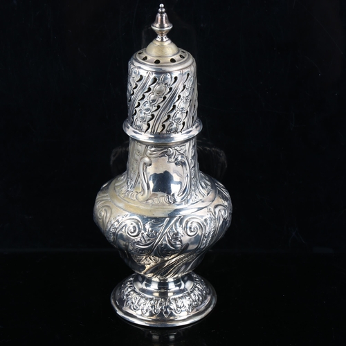 314 - A Victorian silver baluster sugar caster, allover relief embossed foliate decoration, by Sibray, Hal... 