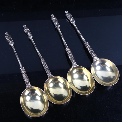 320 - A set of 4 Victorian silver Apostle spoons, with twisted stems and gilded bowls, by Henry John Lias ... 