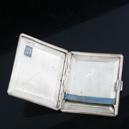 323 - A George V square silver cigarette case, allover engine turned decoration with foliate border, by Co... 