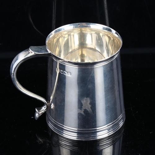 324 - An Edwardian silver christening mug, in Charles II style, by Tessiers Ltd, hallmarks Sheffield 1920,... 