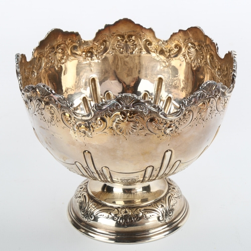 332 - A small Edwardian silver pedestal fruit bowl, relief embossed foliate and fluted decoration, by Leve... 