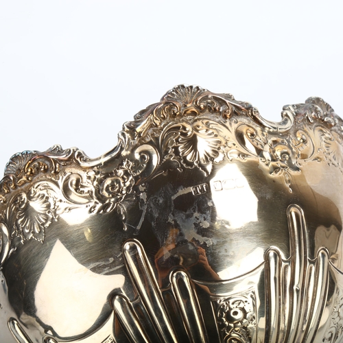 332 - A small Edwardian silver pedestal fruit bowl, relief embossed foliate and fluted decoration, by Leve... 