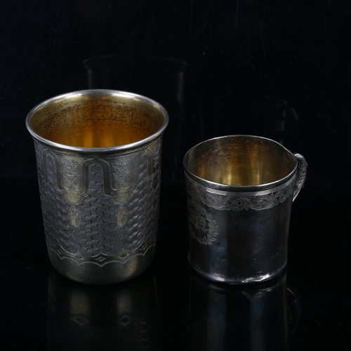 348 - A Continental silver-gilt beaker, and a small unmarked white metal mug, largest height 8cm (2)