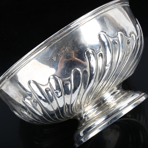 351 - A late Victorian silver pedestal rose bowl, relief embossed half-fluted decoration, by Edward Barnar... 