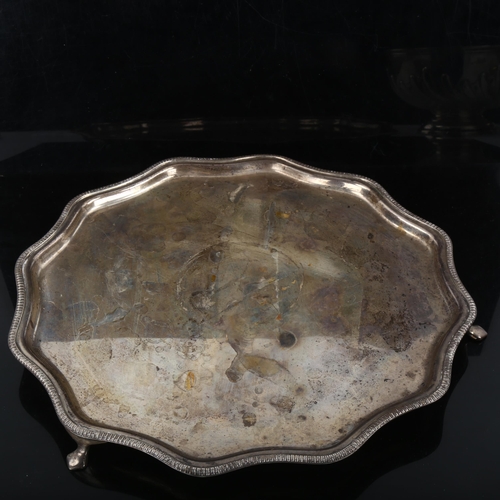 353 - An Edward VIII silver salver, shaped and gadrooned rim on 3 feet, by Frank Cobb & Co Ltd, hallmarks ... 