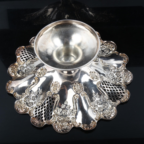 357 - An Edwardian silver pedestal fruit bowl/tazza, with relief embossed floral and pierced lattice decor... 