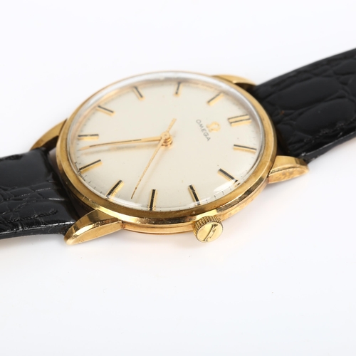 11 - OMEGA - a Vintage 9ct gold mechanical wristwatch, textured dial with baton hour markers and sweep ce... 