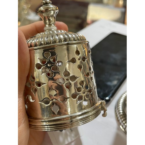 328 - A late 17th century silver lighthouse sugar caster, relief embossed fluted decoration with original ... 