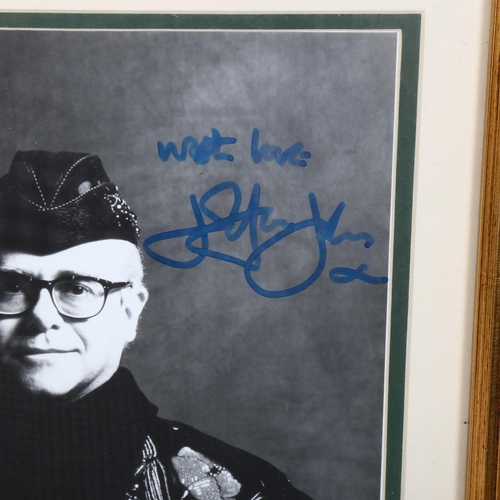 81 - An Elton John autographed Rocket Man photograph, framed, overall 39cm x 34cm, with certificate of au... 