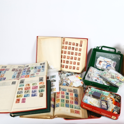 87 - A large quantity of loose world postage stamps and albums