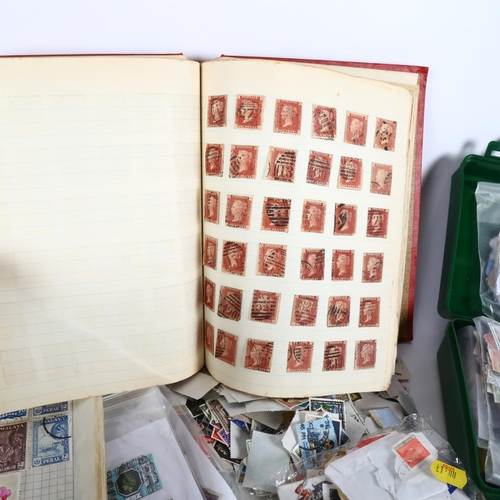 87 - A large quantity of loose world postage stamps and albums