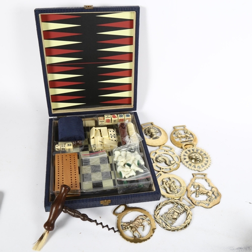 96 - Travelling games box, Antique steel corkscrew, horse brasses etc