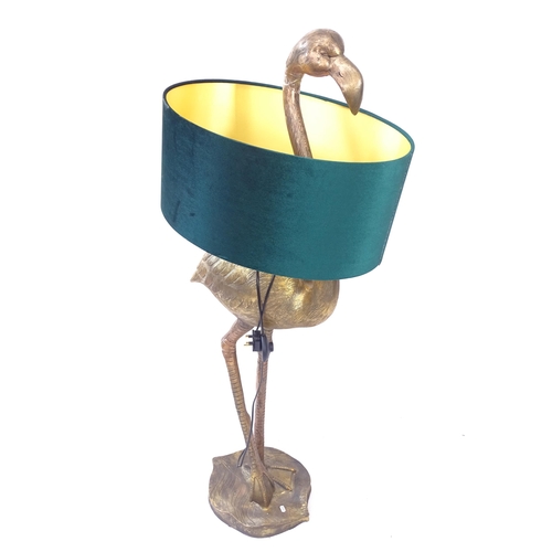 2075 - A decorative floor standing gilt composite floor lamp, in the form of a flamingo with green shade, H... 