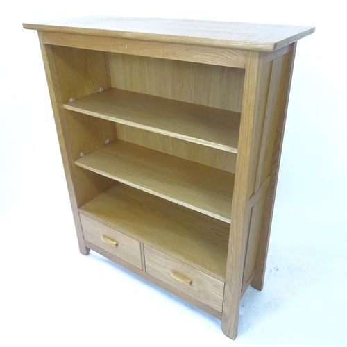 2081 - A modern light oak bookcase, with 2 adjustable shelves and 2 fitted drawers, W105cm, H128cm, D41cm