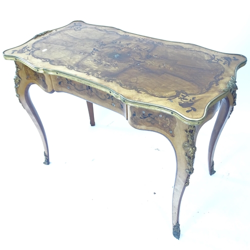 2083 - A French ormolu mounted centre table with shaped top and frieze having extensive mother of pearl, wa... 